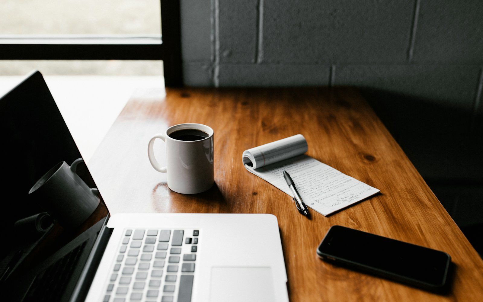 Organized claim files and paperwork on a claims administration desk