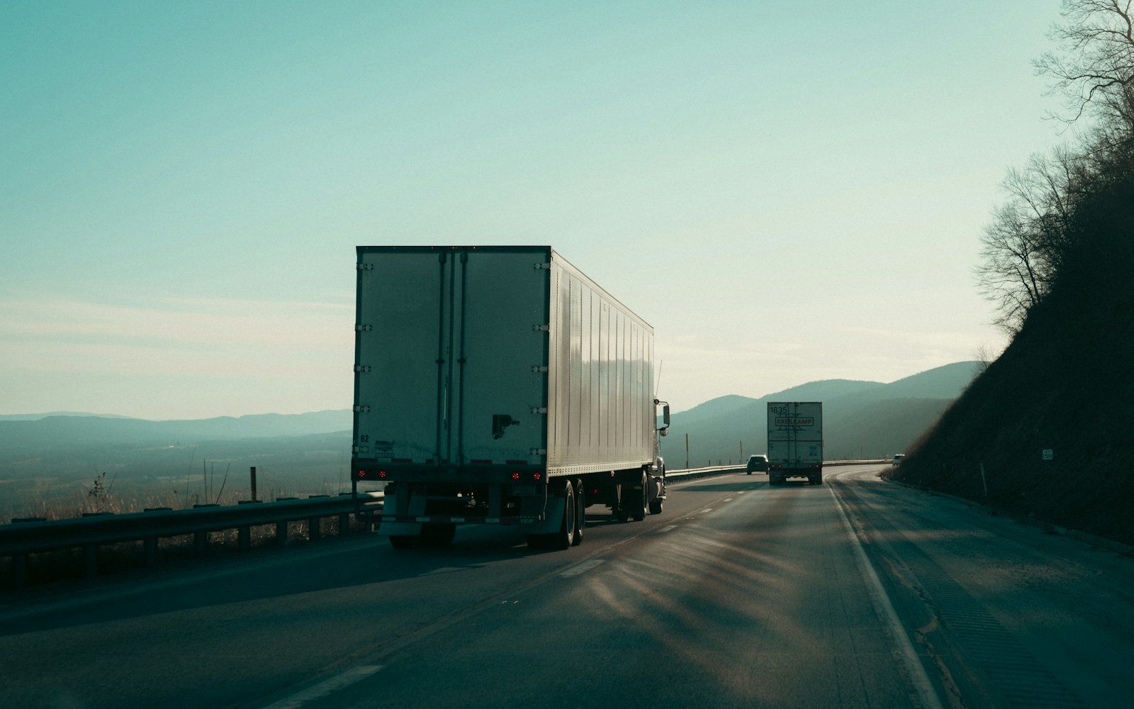 A semi truck on the highway hauling cargo