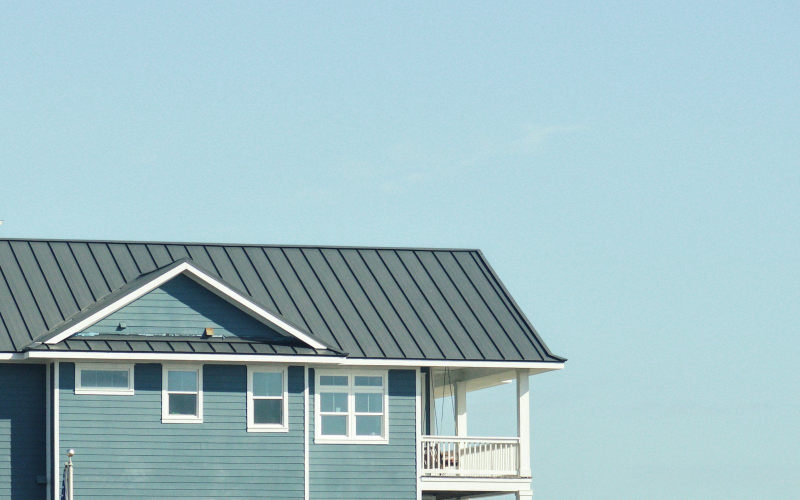 An inspector examining the exterior of a residential property